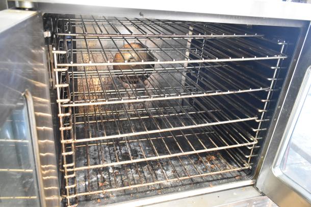 Garland Master 200 convection oven with view-through doors, thermostatic controls, metal legs, and multiple baking racks.