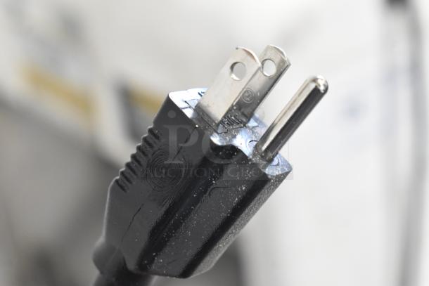 Oliver 797-32NC bread loaf slicer plug, 115 volts, showing prongs and black casing.