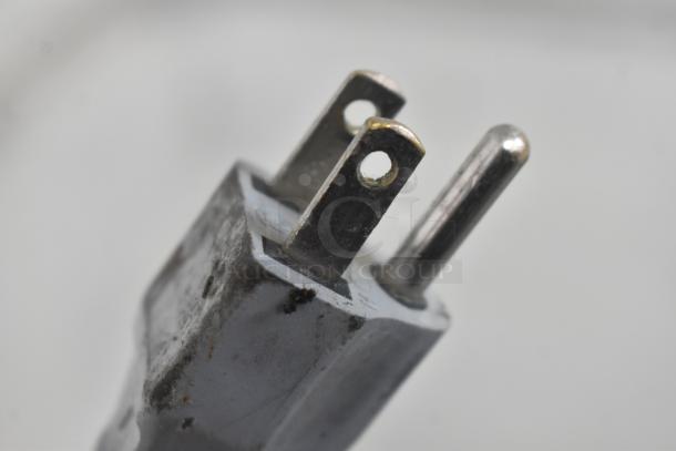 Alt text: Close-up of power plug for Bizerba GSP H meat slicer, 120 volts, showing prongs and slight wear.