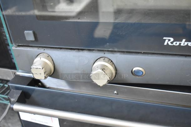Cadco Unox XAF003 Roberta metal convection oven, electric, 120V, 1 phase. Features worn control knobs.