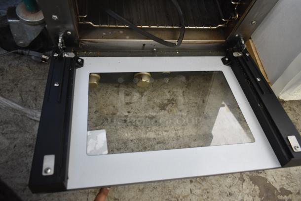 2016 Cadco Unox XAF003 Roberta convection oven, 120V, good condition, visible controls, open door display.