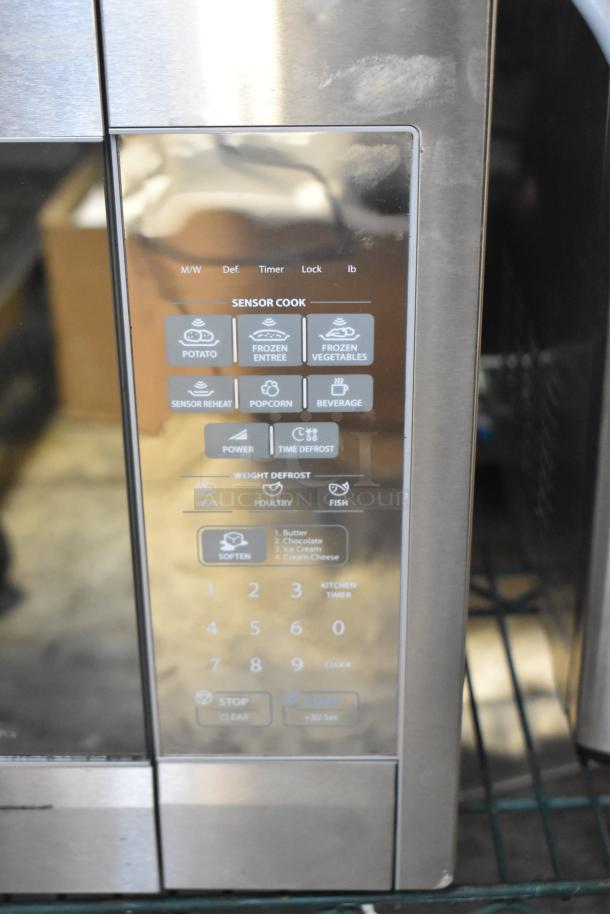 Sharp R-551ZM Microwave Oven, stainless steel, features sensor cook settings, numeric keypad, 120 volts, 1 phase.