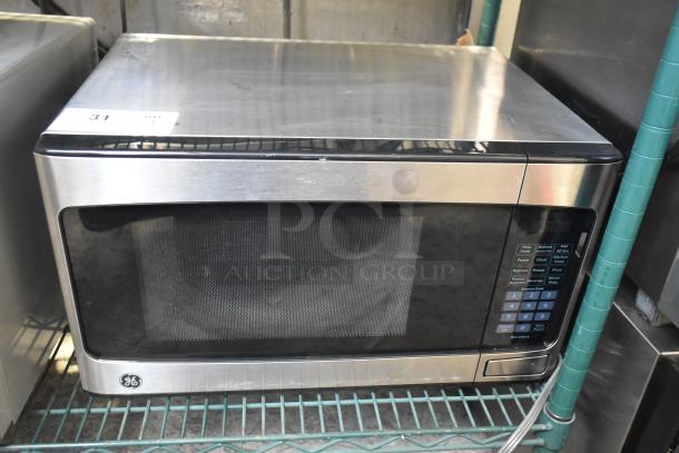 General Electric GE GCST11X1W1SS Microwave Oven, stainless steel, includes plate, 120 volts, 1 phase, used condition.