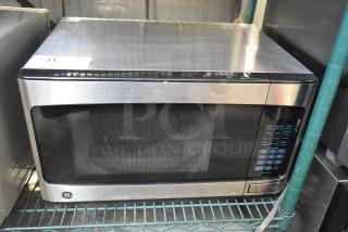 General Electric GE GCST11X1W1SS Microwave Oven, stainless steel, includes plate, 120 volts, 1 phase, used condition.