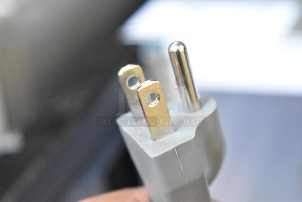 General Electric GE GCST11X1W1SS Microwave Oven plug, showing three-pronged 120V connection.