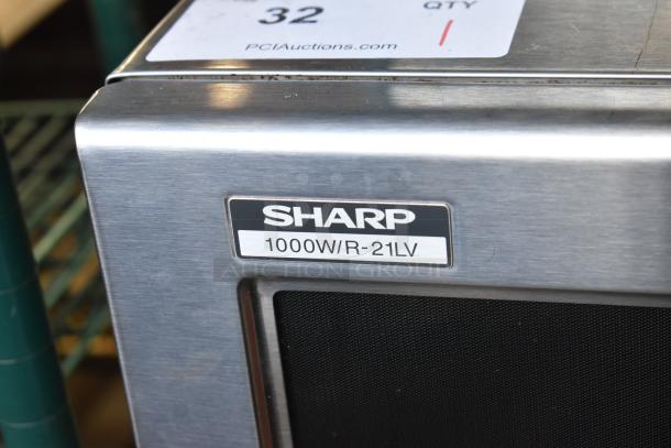 2021 Sharp R-21LVF commercial microwave oven, 1000W, stainless steel, model label visible, 120V, 1 phase.