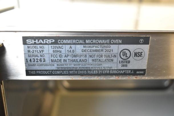 2021 Sharp R-21LVF Commercial Microwave Oven, 120V, 1 Phase, with label indicating model, serial number, and compliance.