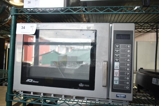 Amana RCS10MPA commercial microwave oven, 120 volts, 1 phase, keypad controls, visible wear, auction tag number 34.