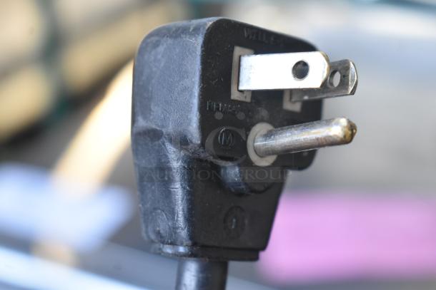 Close-up of a grounded plug, from Amana RCS10MPA Commercial Microwave, 120V, 1 Phase. Used condition.