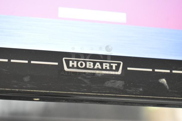 2017 Hobart HTi-7LH26 commercial scale, countertop model. Black with visible Hobart logo. Good condition. 120/208-240V, 1 phase.