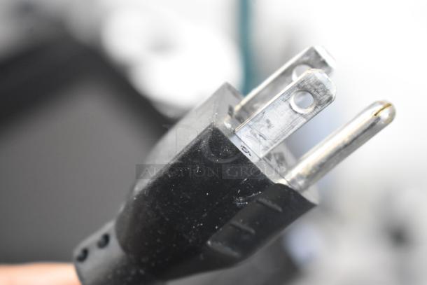 Close-up of a power plug from the 2017 Hobart HTi-7LH26 Commercial Food Portioning Scale. 120/208-240 Volts, 1 Phase.