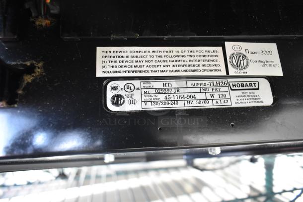 2017 Hobart HTi-7LH26 commercial food portioning scale, 120/208-240V. Features compliance and safety labels.