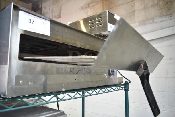 Wisco 560 Countertop Electric Pizza Oven, 120V, 1 Phase. Stainless steel exterior, open front, shelf mount, used condition.