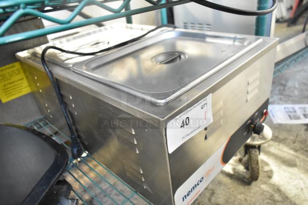 2019 Nemco 6055A countertop food warmer, stainless steel, 120 volts, 1 phase, auction tag visible, excellent condition.