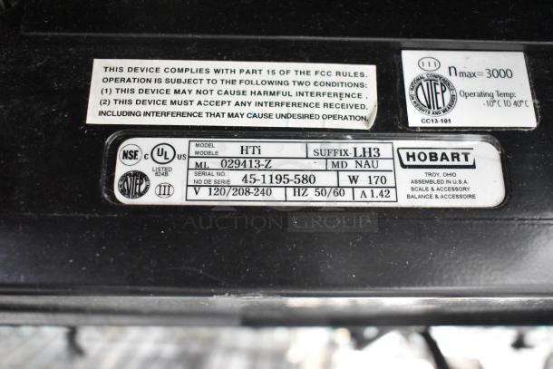 2018 Hobart HTi-7LH3 commercial scale, tested, working. Labels show compliance info, voltage: 120/208-240, phase: 1. Screen damage noted.