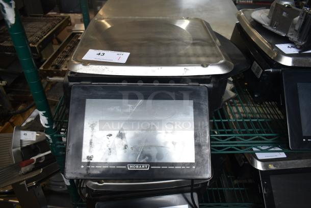2016 Hobart HTi-7LH commercial food portioning scale, condition shows wear, missing power cord, does not power on.