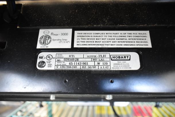 2016 Hobart HTi-7LH commercial food scale label with model, serial number, and power specs. Missing power cord, not functional.