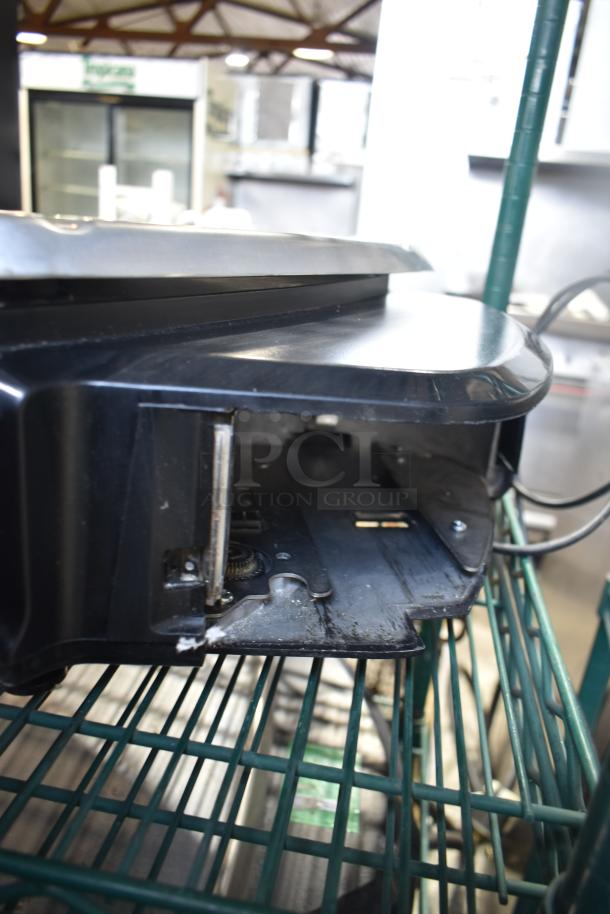 2016 Hobart HTi-7LH Commercial Scale, black, tested and working, 120/208-240V, 1 phase, visible wear, on metal shelf.