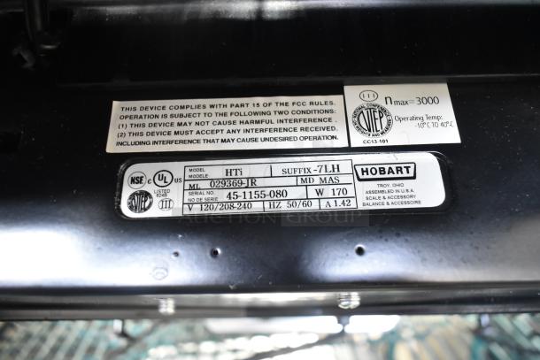 2016 Hobart HTi-7LH commercial food scale, 120/208-240V, tested and working. Labels show model, serial number, and specs.