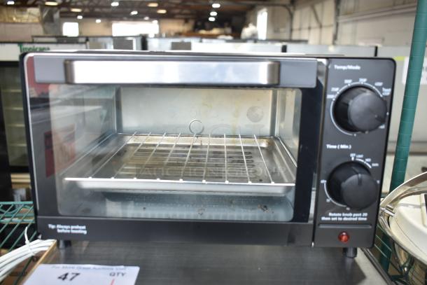 Mainstays MS54100112163 Toaster Oven, 120V, 1 Phase, features dial controls, wire rack, and tray. Used condition.