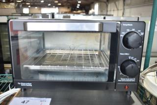 Mainstays MS54100112163 Toaster Oven, 120V, 1 Phase, features dial controls, wire rack, and tray. Used condition.