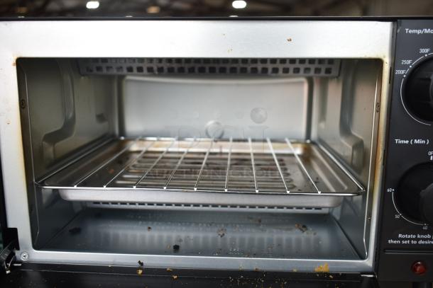 Mainstays MS54100112163 Toaster Oven, 120V, interior with crumb tray, visible wear. Model MS54100112163.