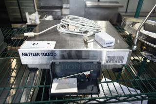 Mettler Toledo BC countertop scale with cables. Stainless steel, barcode visible. Good condition, ideal for commercial use.