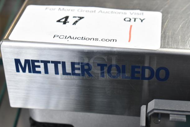 Mettler Toledo BC countertop scale, stainless steel, auction label showing "47 QTY". Model: BC.