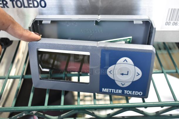 Mettler Toledo BC Countertop Scale panel, blue-gray color, brand name visible, keypad design. Condition appears dismantled.