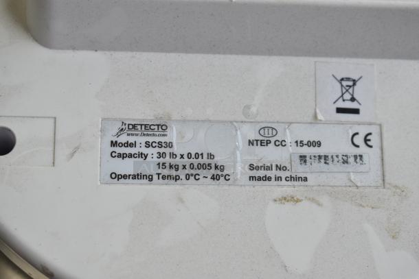 Label of a Detecto SCS30 produce scale, showing model, capacity, and operating temperature details. Made in China.
