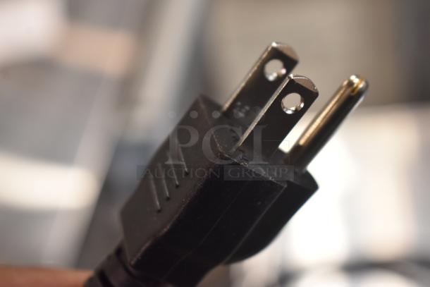 Close-up of a power plug for the 2025 Hobart HTi-7LH4W Commercial Countertop Food Portioning Scale. 120/208-240V, 1 Phase.