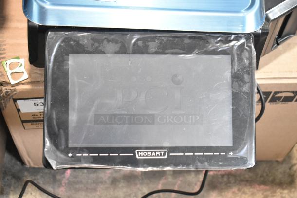 2025 Hobart HTi-7LH4W commercial countertop food portioning scale. Visible display with Hobart logo. 120/208-240V, 1 phase.
