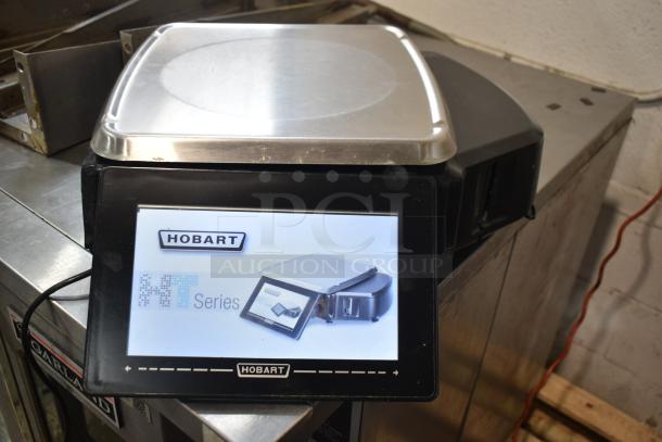 2017 Hobart HTi-7LH26 commercial food portioning scale, stainless platform, touchscreen display, tested and working condition.