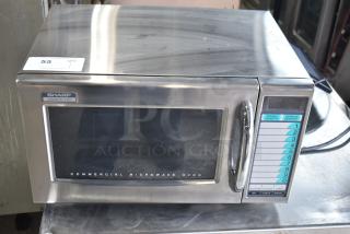 2021 Sharp R-21LVF commercial microwave oven, 120V, 1 phase, stainless steel, visible controls and branding, in good condition.