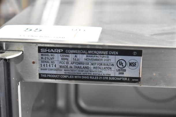 2021 Sharp R-21LVF commercial countertop microwave oven, 120V, 1 phase, model and serial tags visible on side, used.