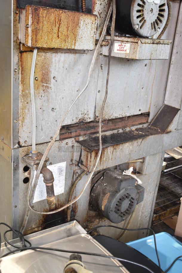 Montague commercial gas convection oven, rusted exterior, view doors, thermostatic controls; labels include "Not A Lift Handle".