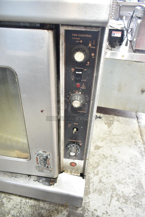 Montague commercial gas convection oven with view-through doors and thermostatic controls, metal exterior, used condition.