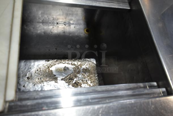 Commercial prep table, stainless steel, 115 volts, 1 phase. Visible wear and residue, indicating used condition.