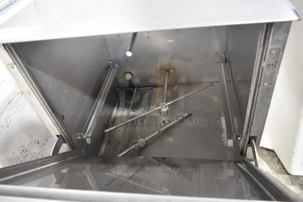 Jackson Avenger Undercounter Dishwasher, stainless steel interior, visible spray arms, functional condition, model details inside.