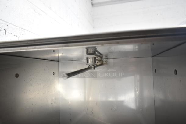 Jackson Avenger Undercounter Dishwasher interior showing stainless steel wash arm, light wear visible on surfaces.