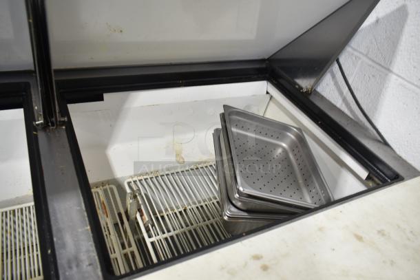 True TSSU-72-30M-B-ST sandwich salad prep table, mega top with bain marie, stainless steel pans, commercial casters, used condition.