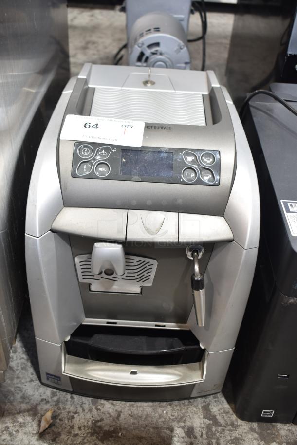 LavAzza countertop espresso machine with steam wand, 115V, 1 phase. Features control panel, used condition, auction tag visible.
