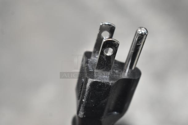 Close-up of a plug for a LavAzza Countertop Espresso Machine, 115 volts, 1 phase.