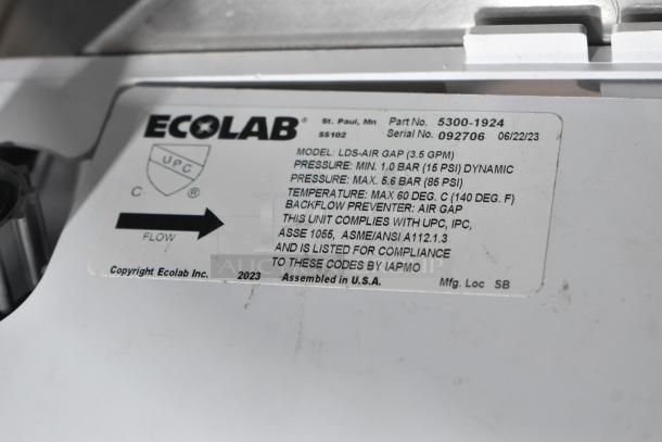 Ecolab LDS-Air Gap label with flow direction, pressure, temperature specs, and compliance codes; assembled in USA.