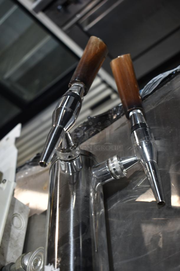 Metal beer tower with dual taps; part of a 4-item auction lot including Ecolab dispenser and fire suppression box.