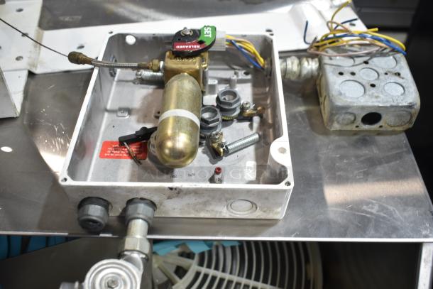 4-item lot featuring a beer tower, Ecolab dispenser, fire suppression box, and metal piece. Condition varies.