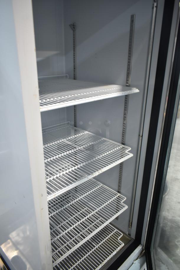 Everest EMGR24 single door cooler, white interior, adjustable shelves, commercial use, 115V, 1 phase, clean condition.