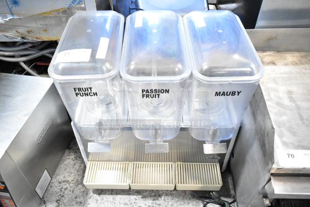 Crathco Commercial 3 Hopper Refrigerated Beverage Machine, labels for fruit punch, passion fruit, mauby. 115 Volts, 1 Phase.