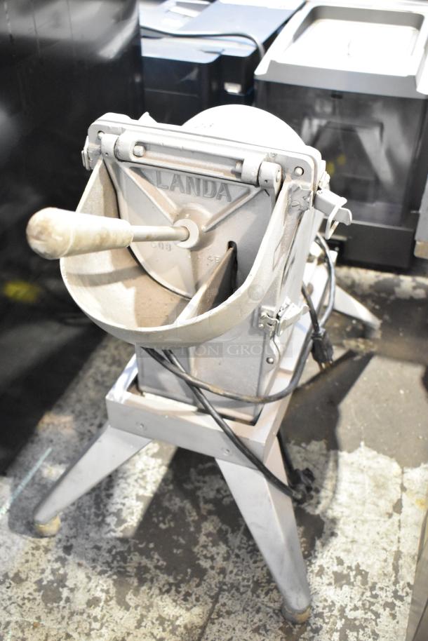 Lamda commercial countertop vegetable and cheese cutter, 115 volts, 1 phase, sturdy metal construction, visible handle and markings.