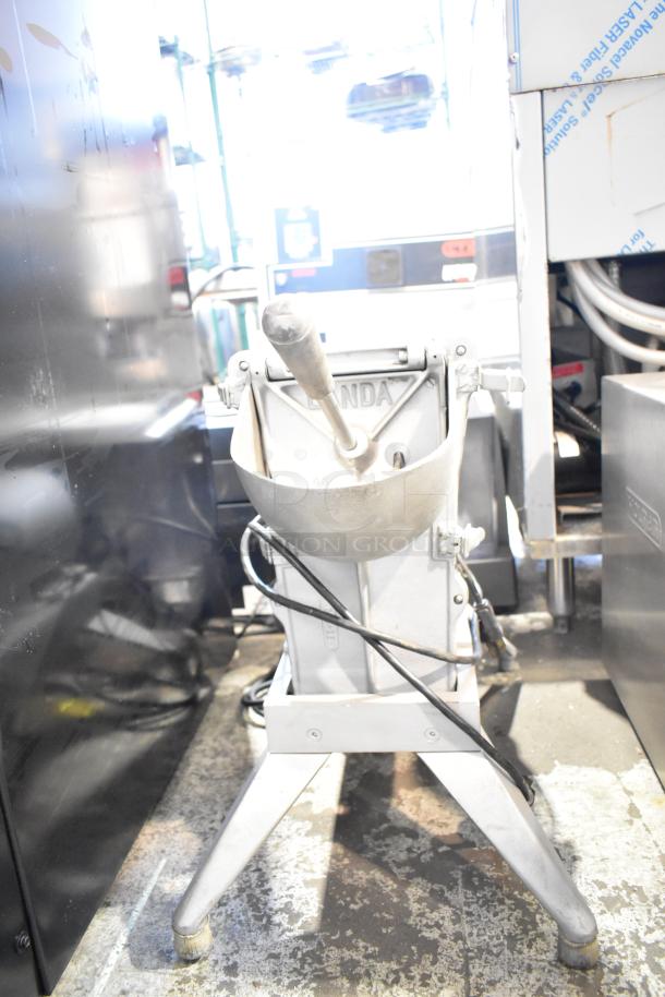 Alt text: Lamda Commercial Countertop Vegetable/Cheese Cutter, 115V, 1 Phase, sturdy metal construction, used condition.